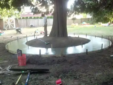 Circular Kids' Bike Track Around a Tree: concrete patio and wall work by Redmond Concrete, concrete contractor serving Bothell (photo 4 of 6)