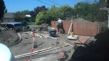 Driveway Extension & Retaining Wall in Bellevue, WA: concrete driveway work by Redmond Concrete (photo 1 of 6)