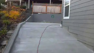 Long Driveway with Curb in Everett, WA: concrete driveway work by Redmond Concrete (photo 4 of 6)