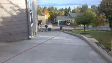 Long Driveway with Curb in Everett, WA: concrete driveway work by Redmond Concrete (photo 5 of 6)