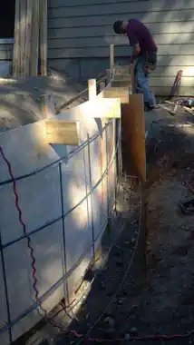 Radius Retaining Wall, Patio & Fire Pit in Bothell, WA: concrete patio and wall work by Redmond Concrete (photo 3 of 6)