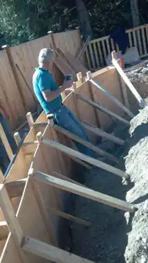 Radius Retaining Wall, Patio & Fire Pit in Bothell, WA: concrete patio and wall work by Redmond Concrete (photo 5 of 6)