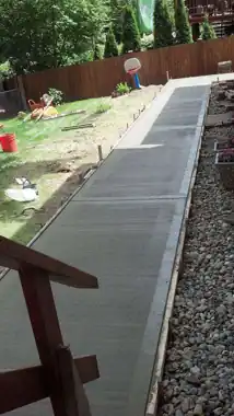 Side Walkway & Utility Pad in Bothell, WA: concrete walkway and steps work by Redmond Concrete (photo 6 of 6)